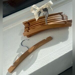 SET of 14 wooden children’s clothes hangers. Pale wood, fresh clean look.